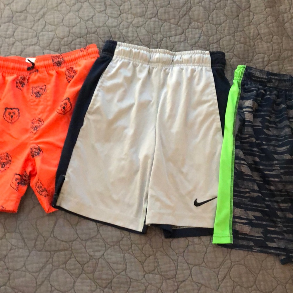 Two boys shorts and one boys swim trunk